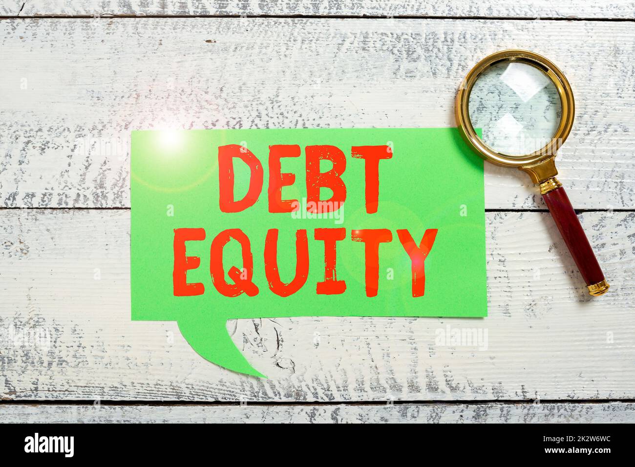 Writing displaying text Debt Equity. Conceptual photo dividing companys total liabilities by its stockholders Lady in suit holding pen symbolizing successful teamwork accomplishments. Stock Photo