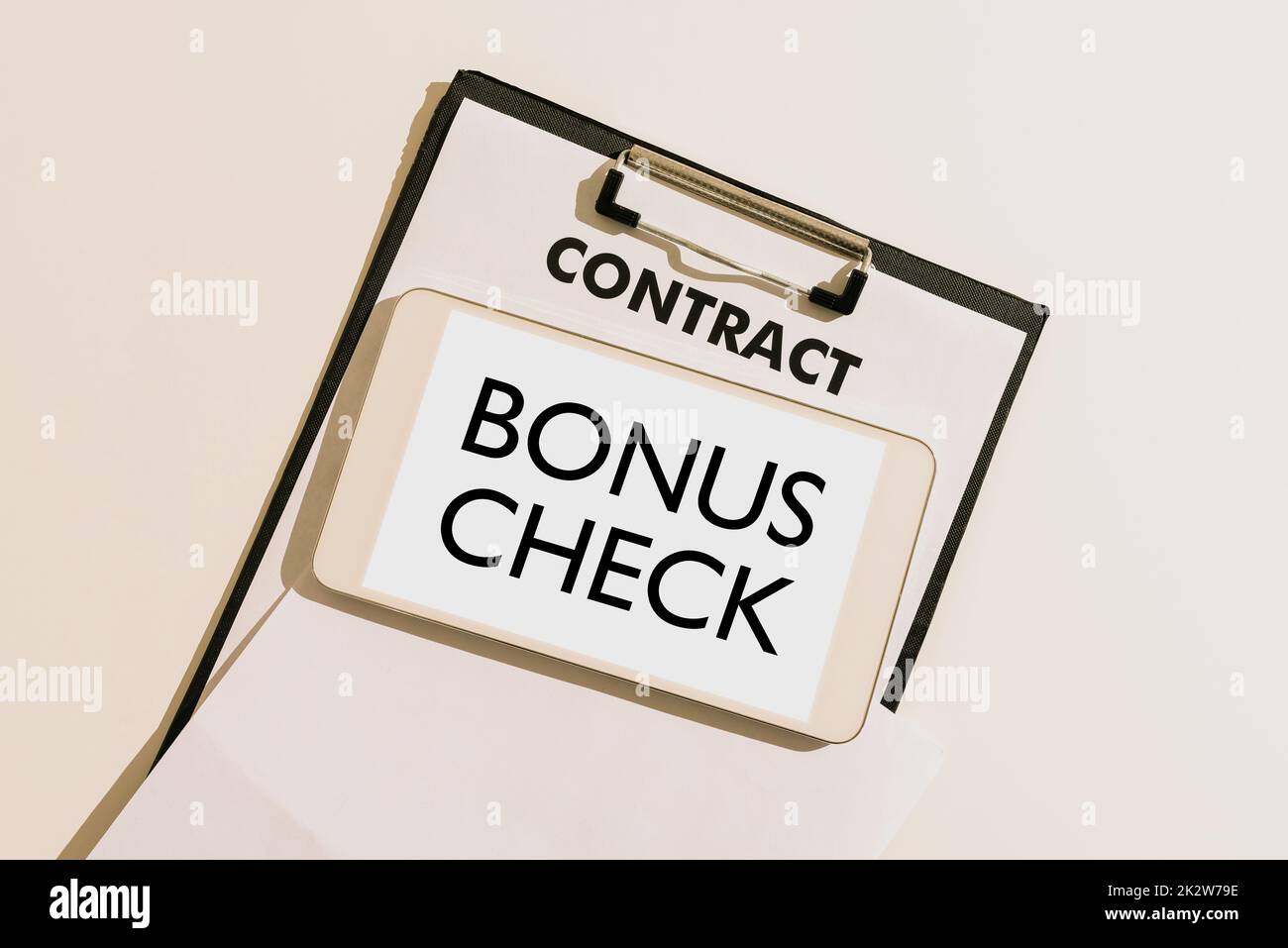Conceptual caption Bonus Check. Business concept something in addition to what is expected or strictly due -47108 Stock Photo