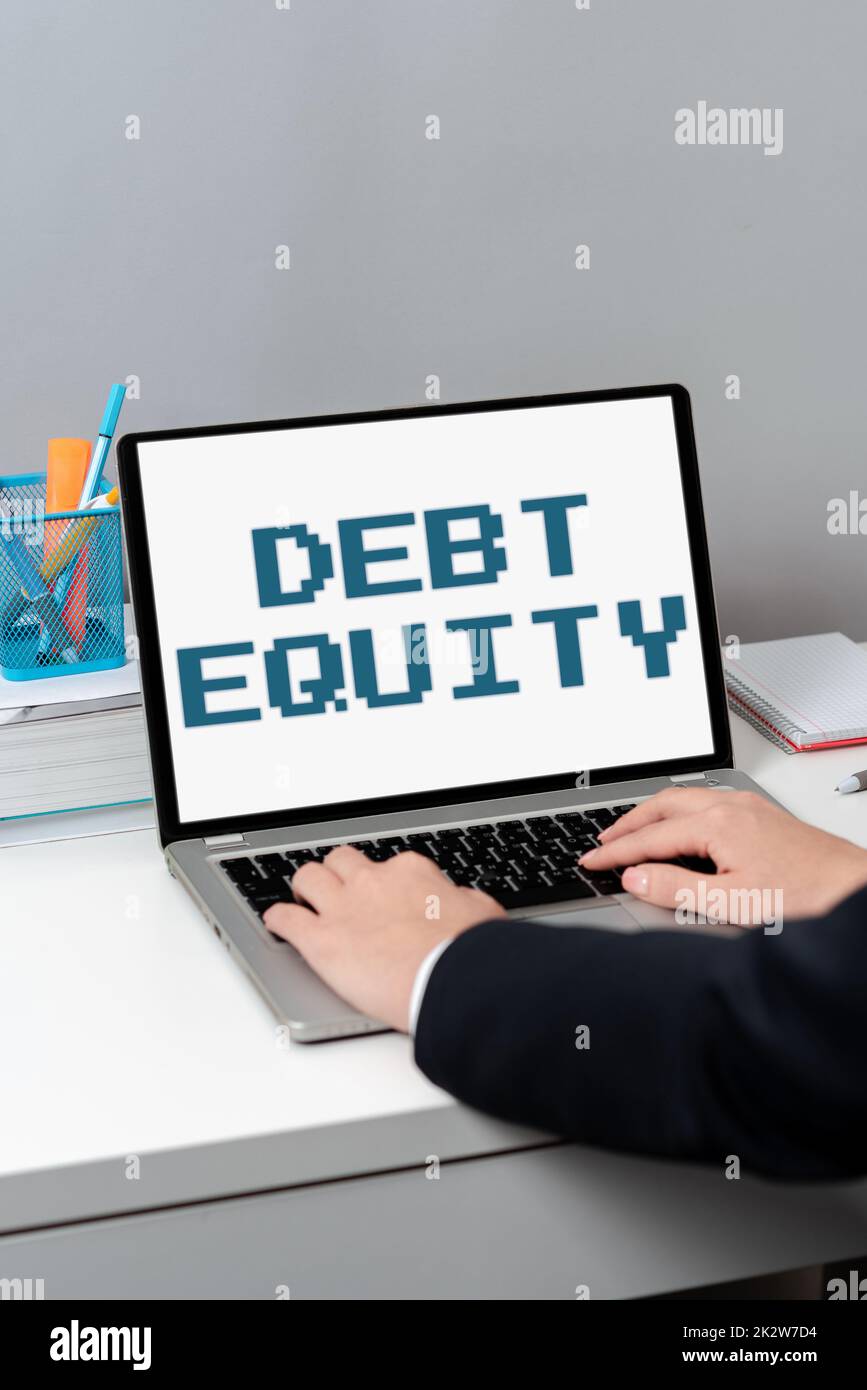 Text showing inspiration Debt Equity. Business showcase dividing companys total liabilities by its stockholders -47544 Stock Photo