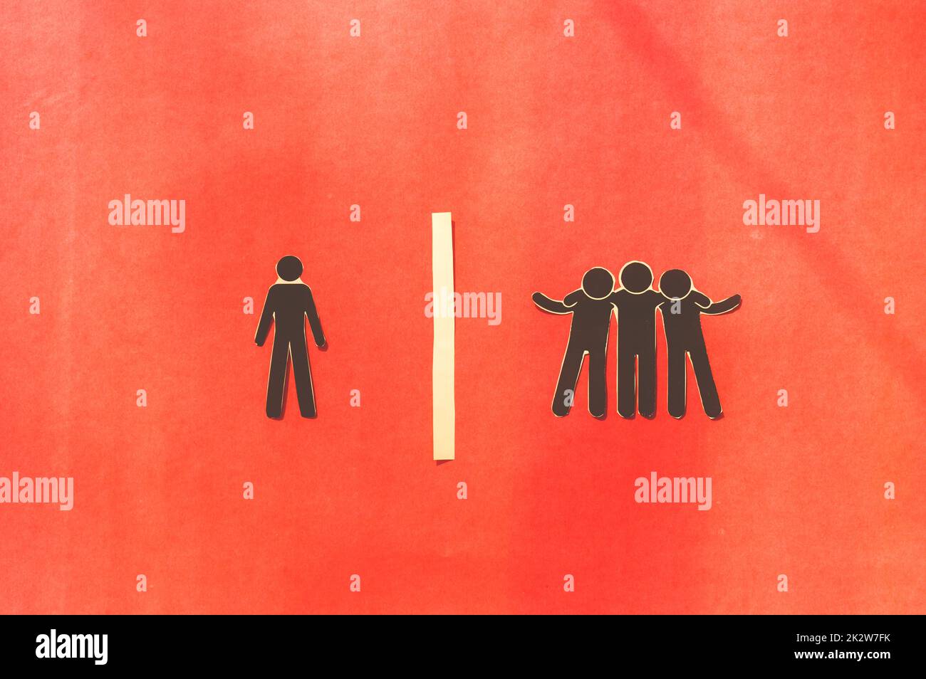 Paper man standing Isolated from group. Feel Left out and alone. Social