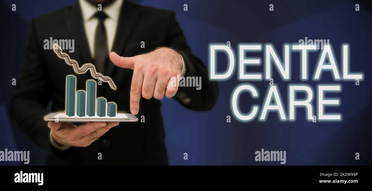 Conceptual caption Dental Care. Internet Concept maintenance of healthy teeth or to keep it clean for future Businessman in suit holding notepad symbolizing successful teamwork. Stock Photo