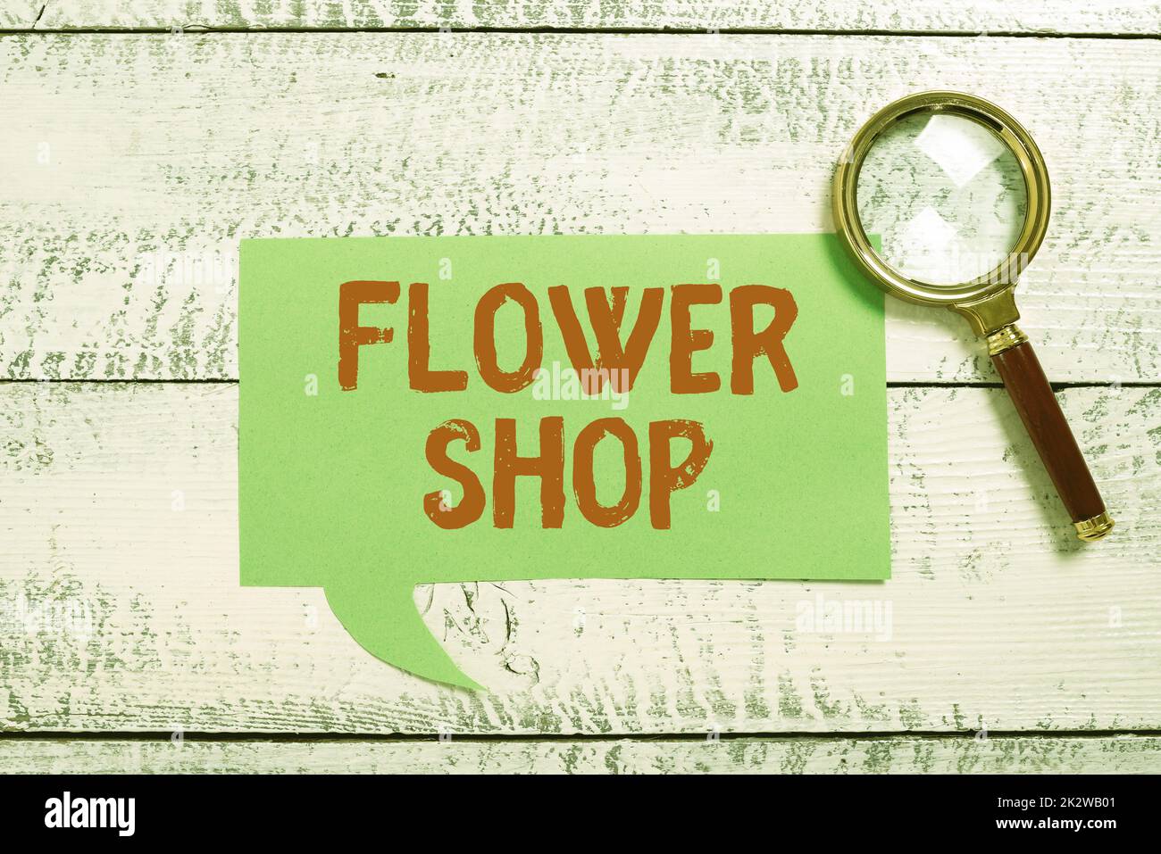 Hand writing sign Flower Shop. Business concept where cut flowers are sold with decorations for gifts -48243 Stock Photo