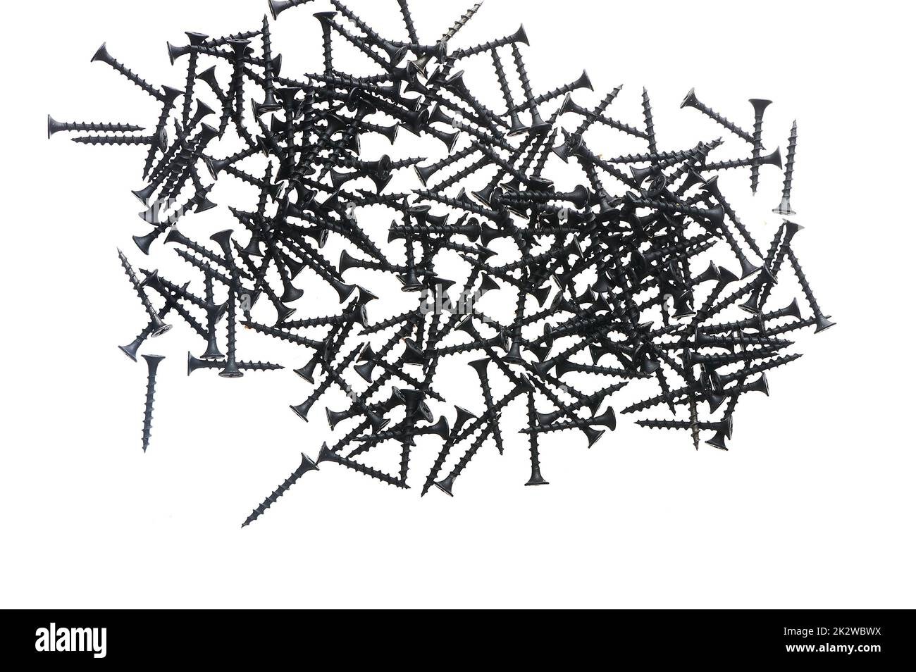 Black construction screws on wood on a white isolated background Stock Photo