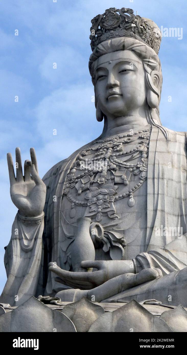 A giant statue with a blue sky background Stock Photo Alamy