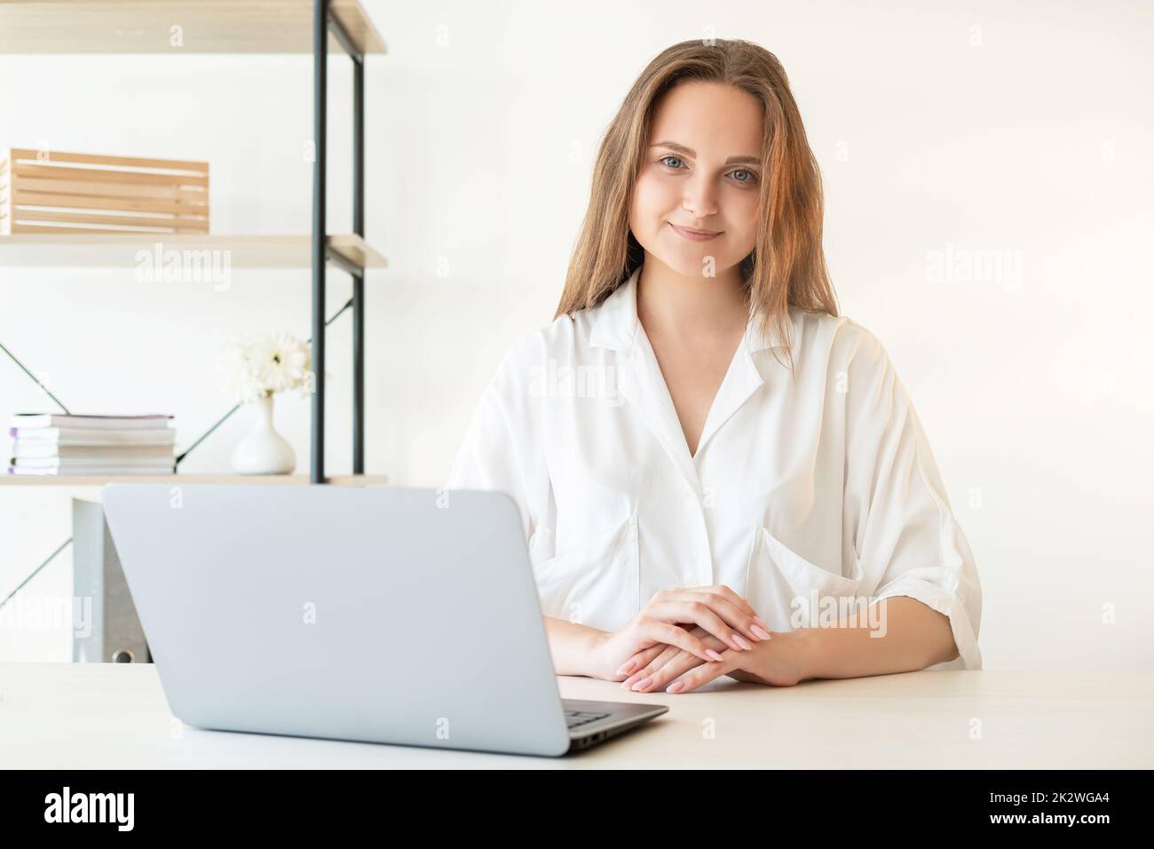 Freelancer lifestyle. Remote job. Professional career. Successful female leadership. Confident cheerful smart woman working from home office with lapt Stock Photo