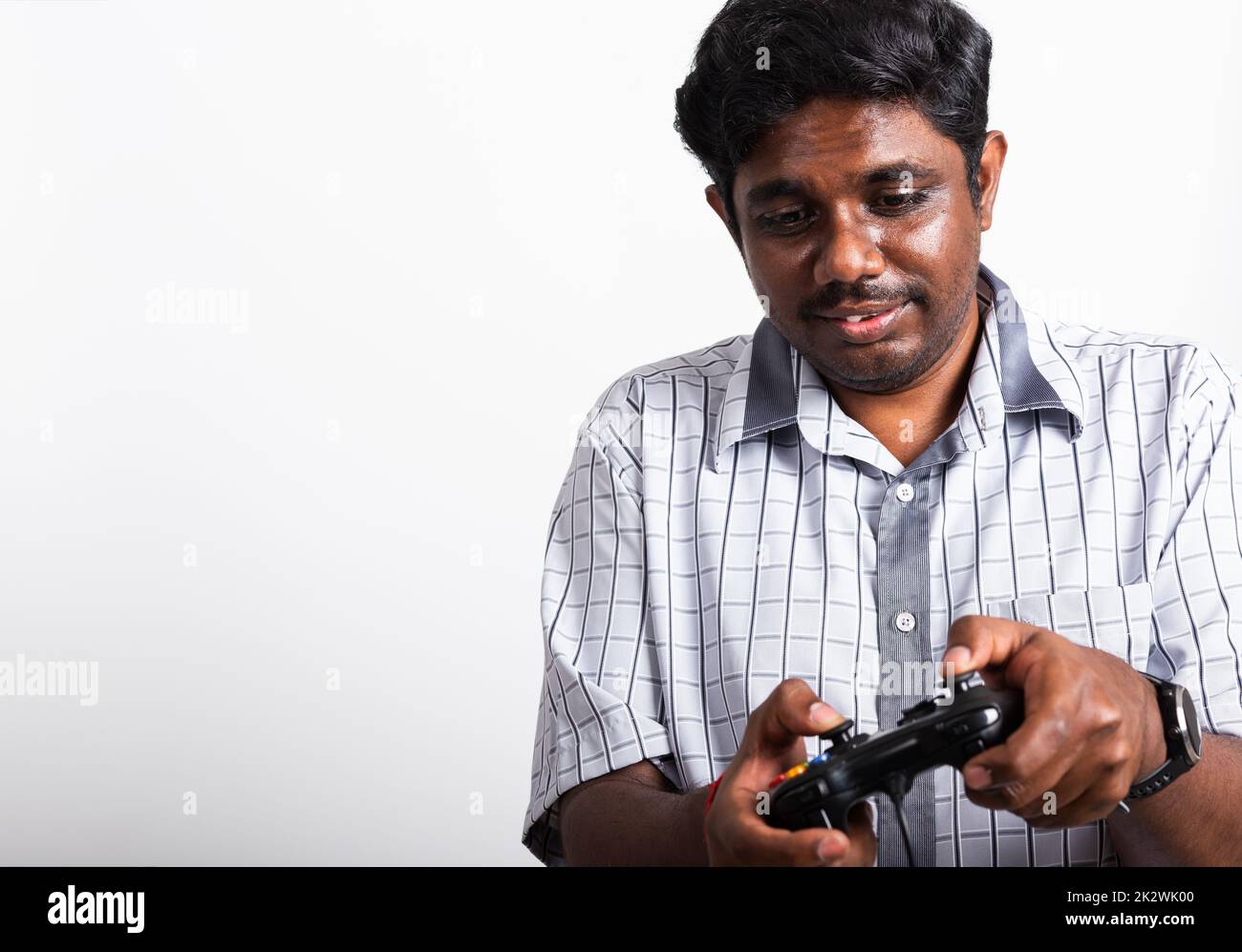 black man funny use hand playing video game pad joystick Stock Photo