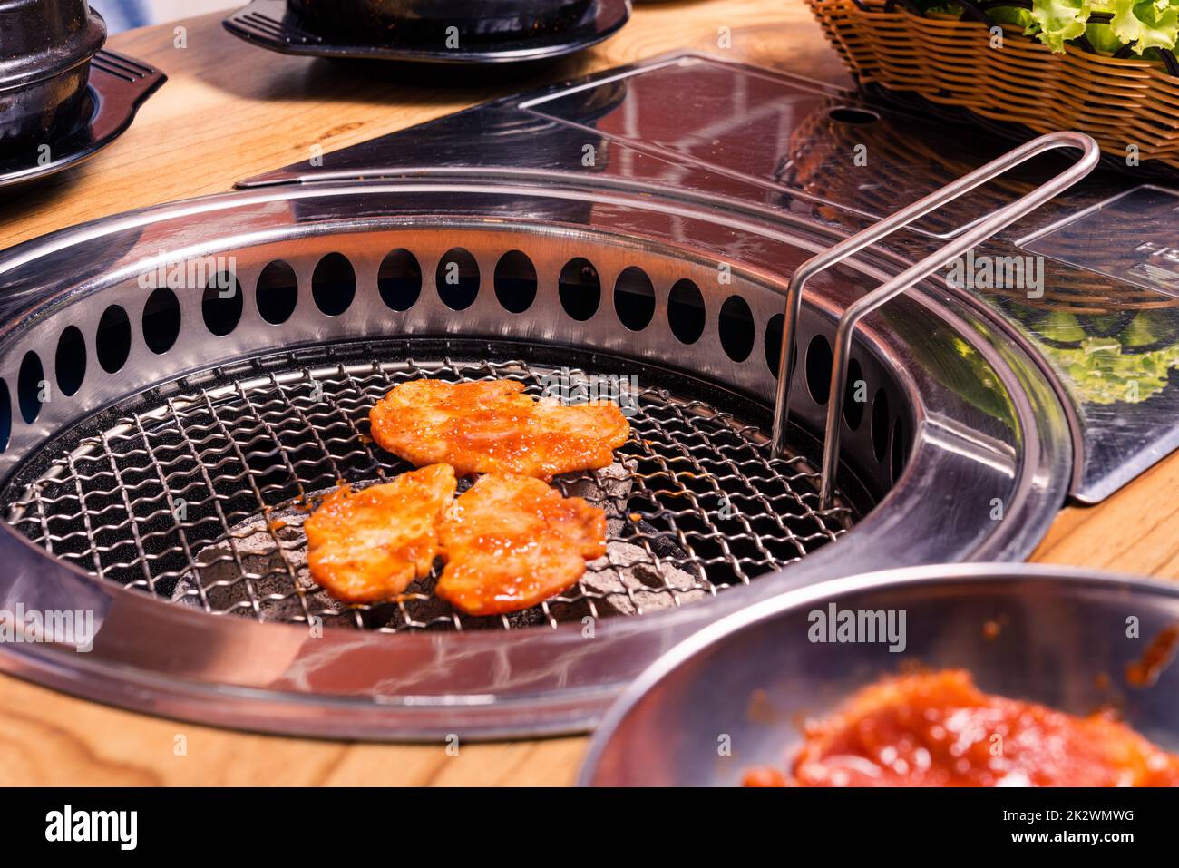 Grilling meat pork Korean BBQ traditional style on stove serve in
