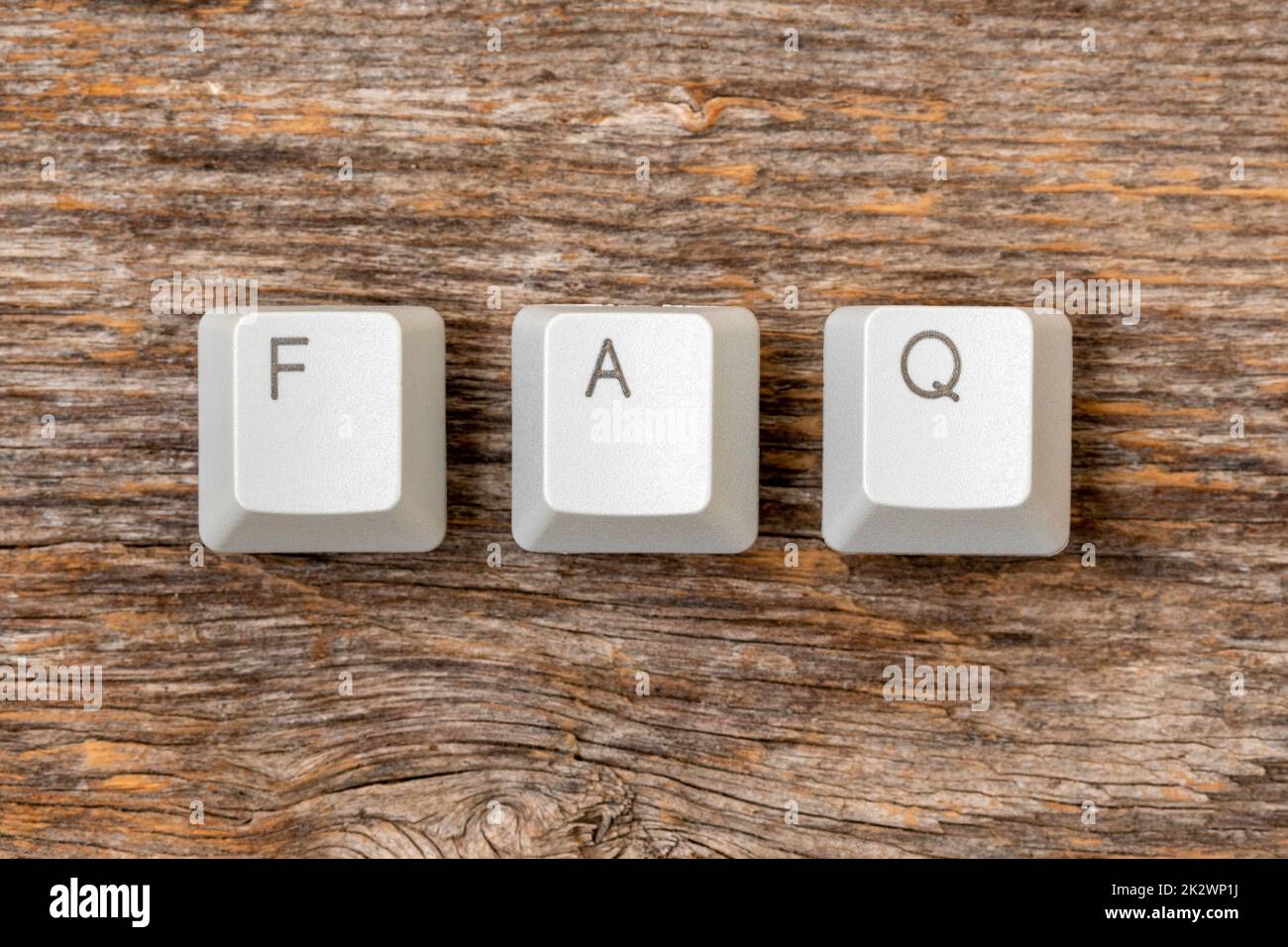 Four computer keyboard keys arranged to spell FAQ word Stock Photo