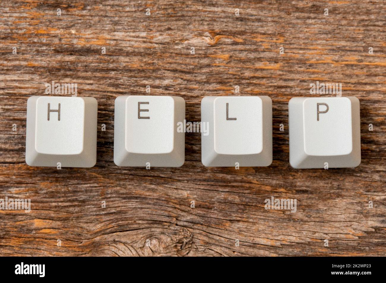 Four computer keyboard keys arranged to spell HELP word Stock Photo