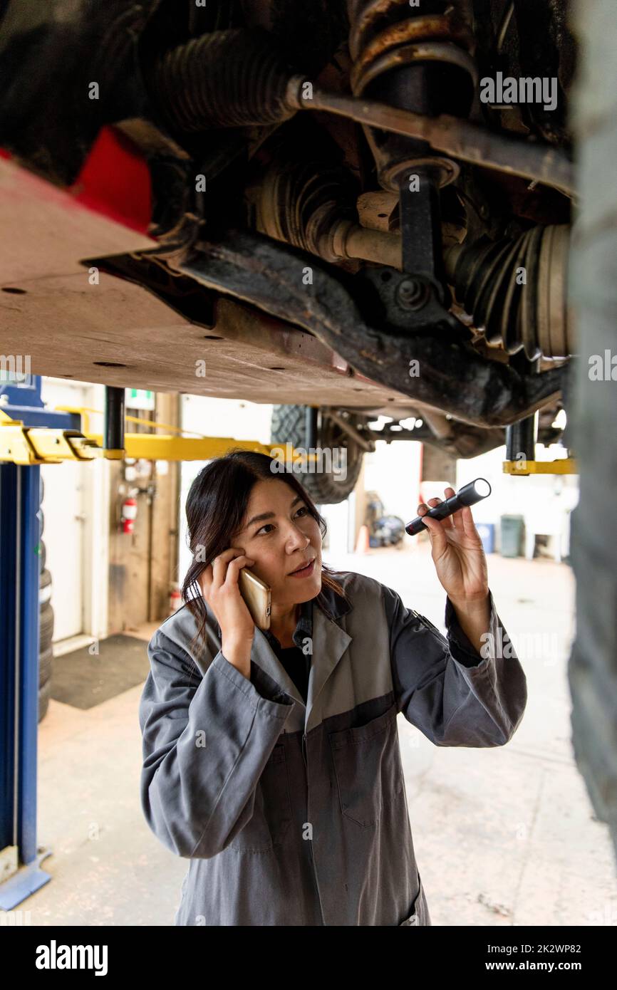 Mechanic woman under the car hi-res stock photography and images - Alamy