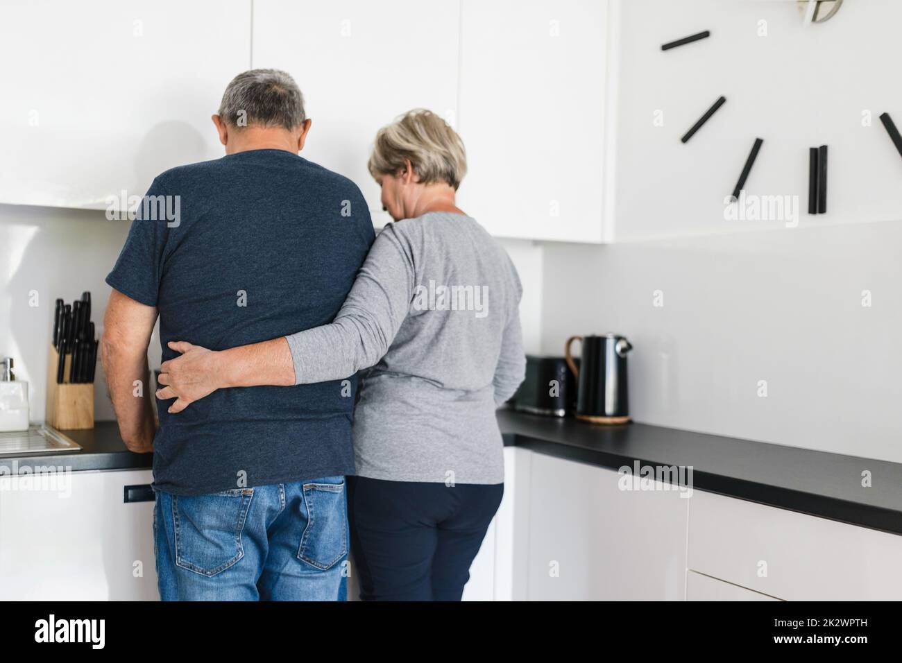 Happy romantic senior couple in love cooking at home Stock Photo