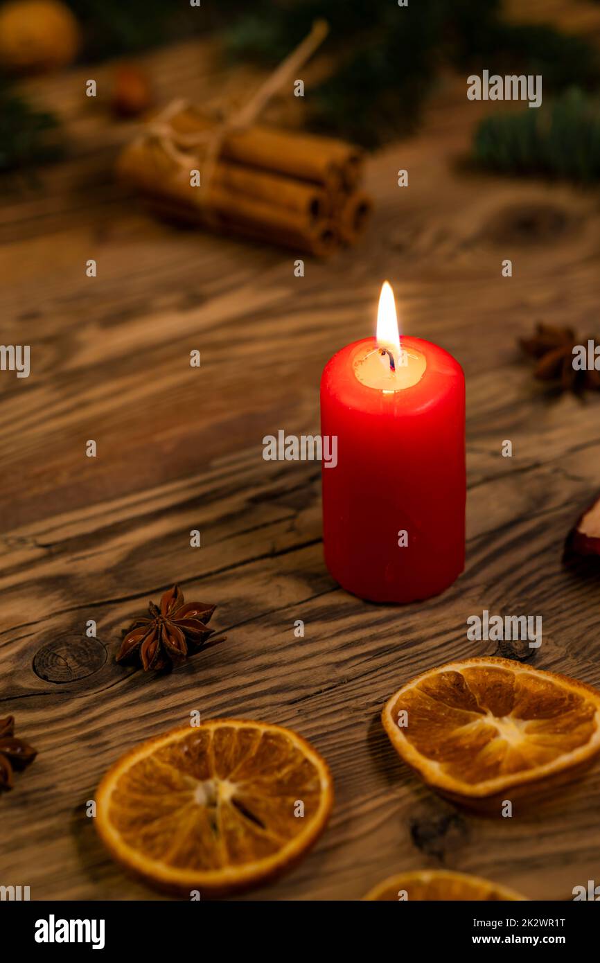 Traditional Czech Christmas on wood decoration with twig, candle, apple, orange, fruit Stock Photo