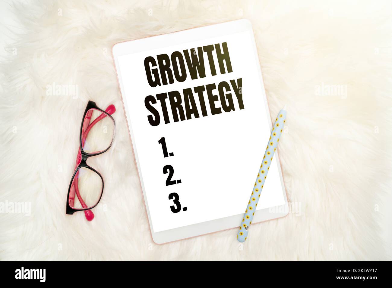 Sign displaying Growth Strategy. Business overview Strategy aimed at winning larger market share in shortterm Office Supplies Over Desk With Keyboard And Glasses And Coffee Cup For Working Stock Photo