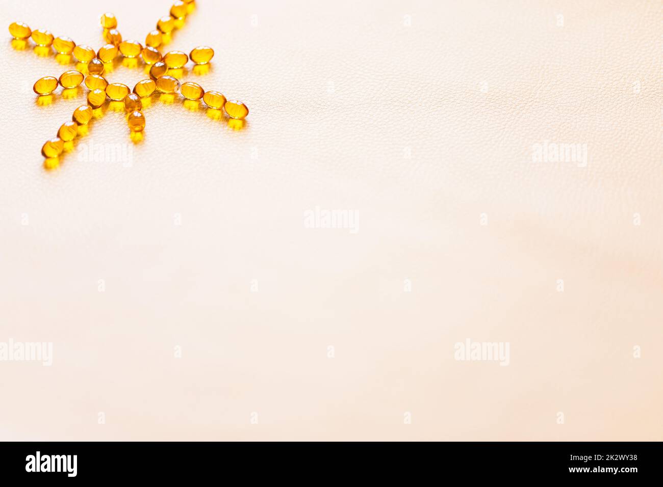 Vitamin D3 capsules. Medicine vitamins and dietary supplements. Selective focus. Close up of oil filled capsules suitable for: fish oil, omega 3, omega 6, omega 9, vitamin A, vitamin D, vitamin D3, vitamin E Stock Photo
