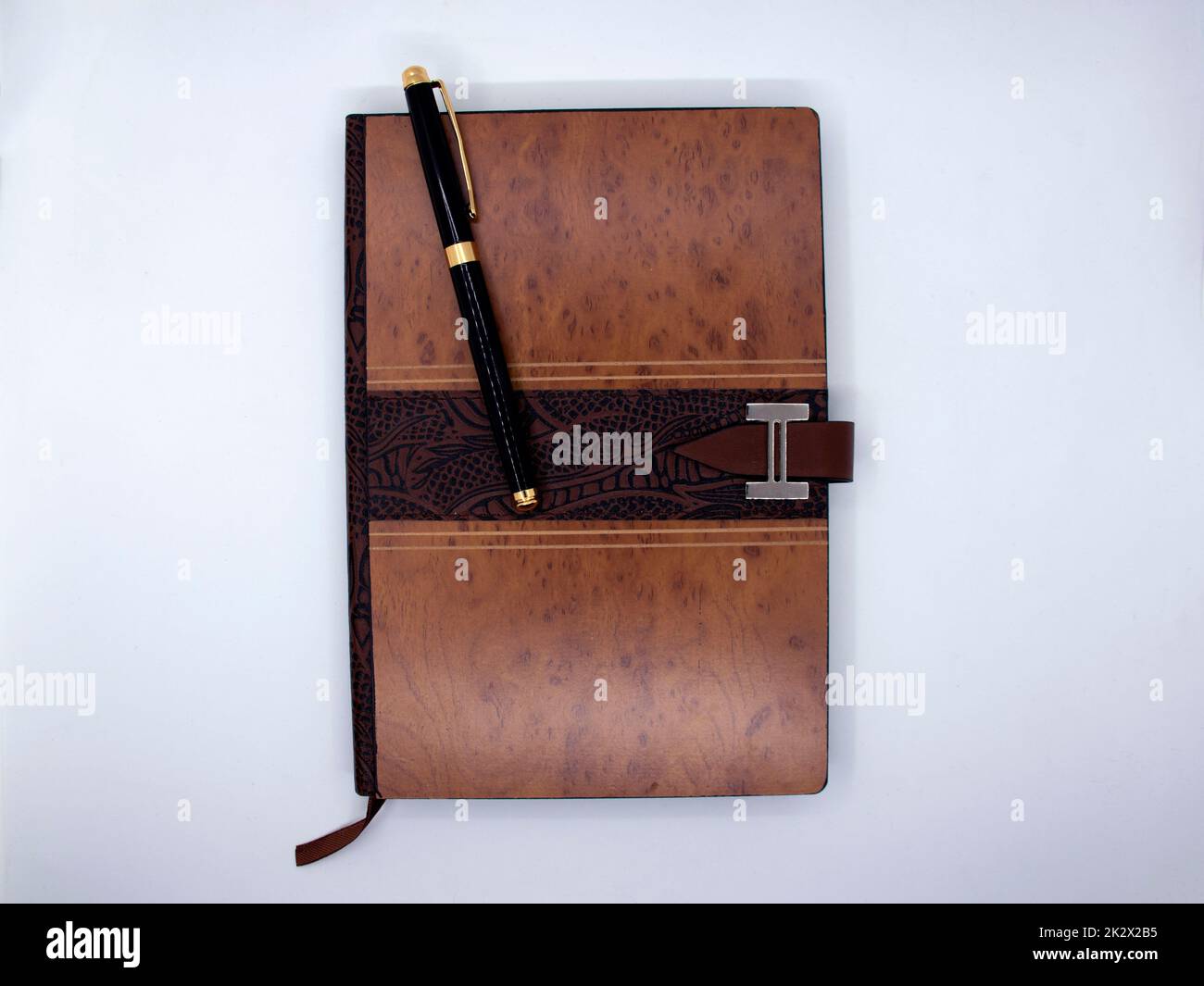 Notepad with ballpoint pen isolated on white background Stock Photo