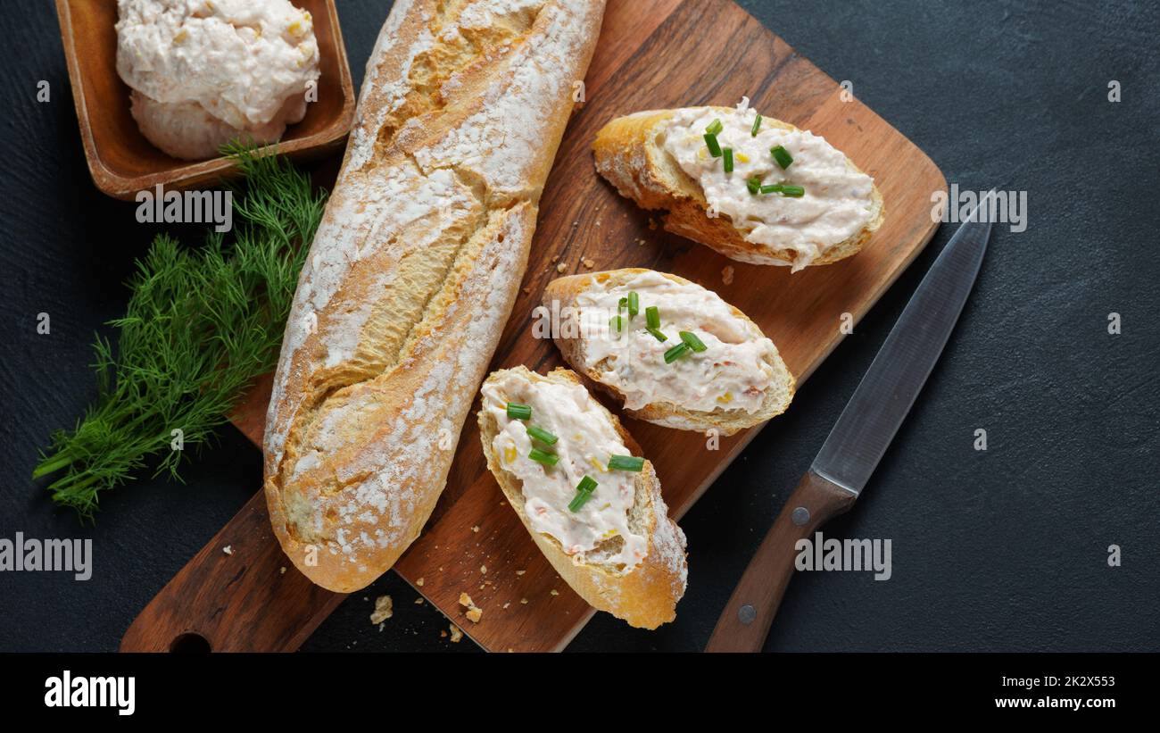 French baguette with or Sandwiches with smoked salmon and soft cream cheese pate or mousse Stock Photo