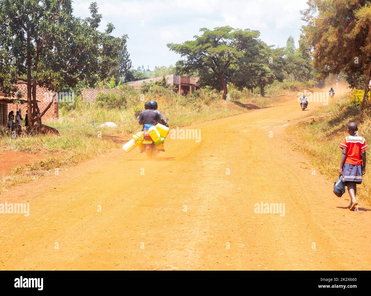motorbike driver was going to fill some water in Uganda Stock Photo Alamy