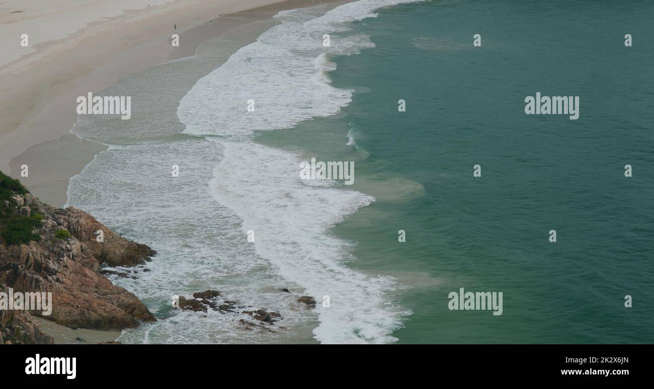 Sea wave splash on rock at beach Stock Photo - Alamy