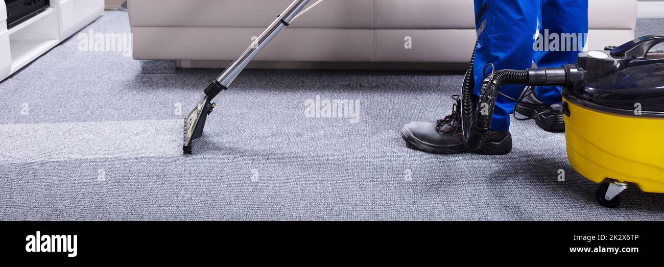 Janitor Cleaning Carpet Stock Photo