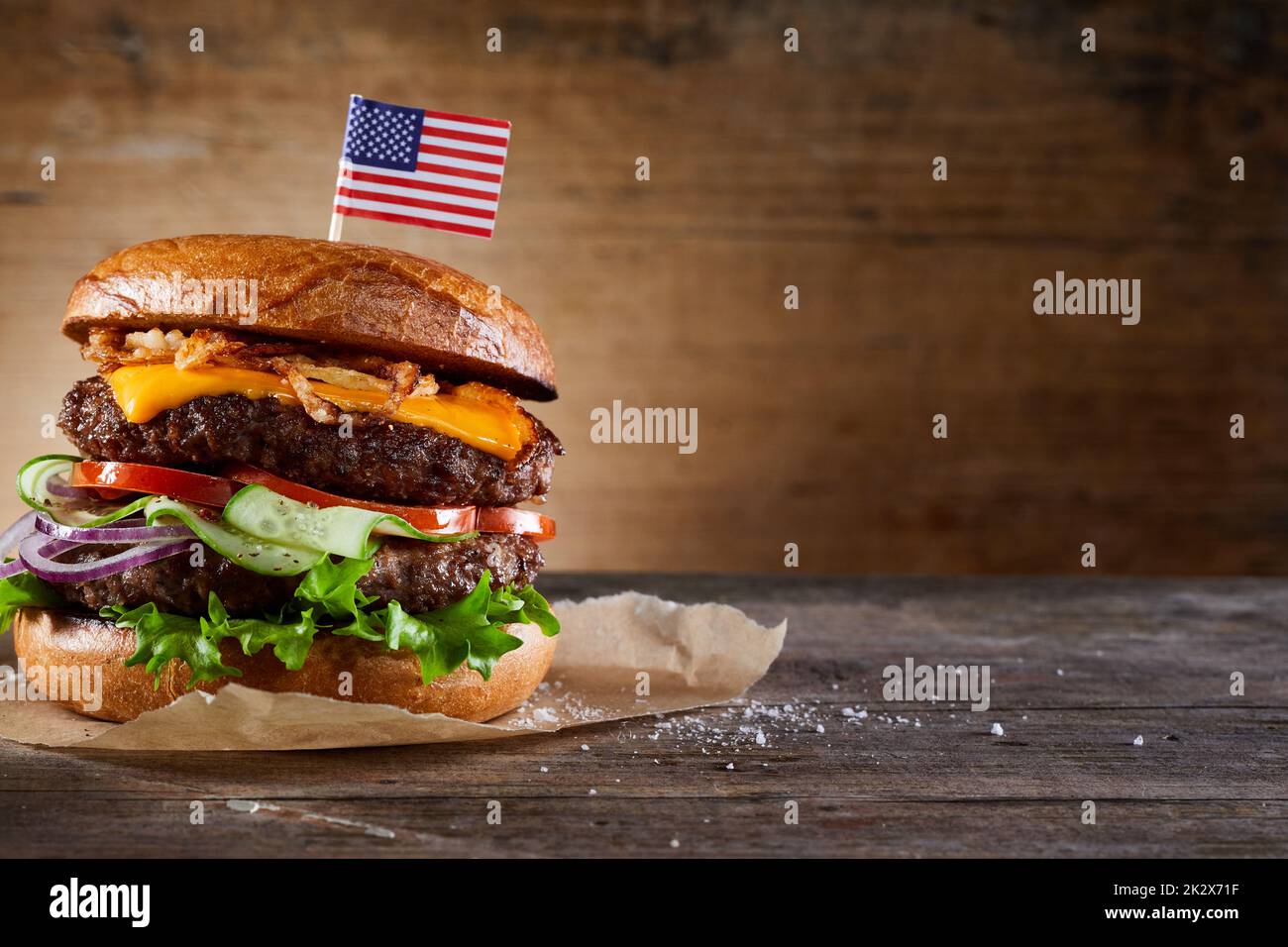 Burger with American flag skewer on table Stock Photo