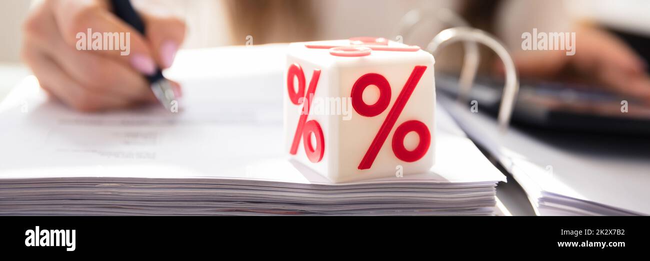 Cubic Block With Red Percentage Symbol Stock Photo
