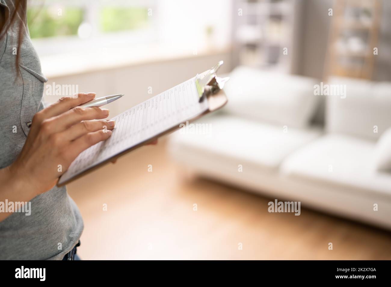 Woman Filling Real Estate Appraisal Form Stock Photo