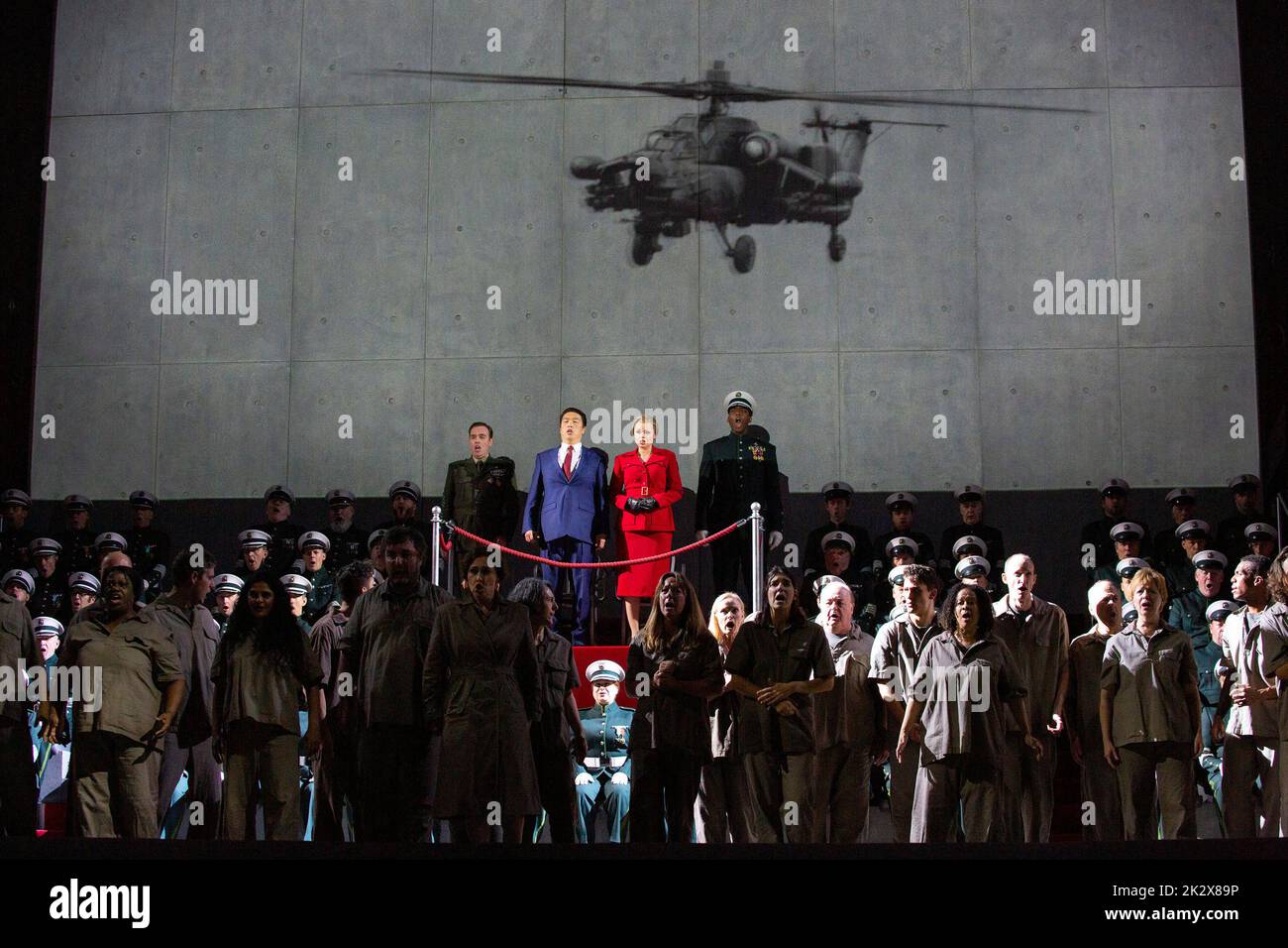 video image of warfare in a new production of AIDA by Verdi opening at The Royal Opera, Covent Garden, London WC2 on Sunday 25/09/2022 an updated version originally set in Egypt now with overtones or references to war in Europe rear centre, l-r: Francesco Meli (Radames), In Sung Sim (King of Egypt), Agnieszka Rehlis (Amneris), Soloman Howard (Ramfis) conductor: Antonio Pappano set design: Miriam Buether costumes: Annemarie Woods lighting: Robert Carsen & Peter van Praet video design: Duncan McLean choreographer: Rebecca Howell director: Robert Carsen Stock Photo