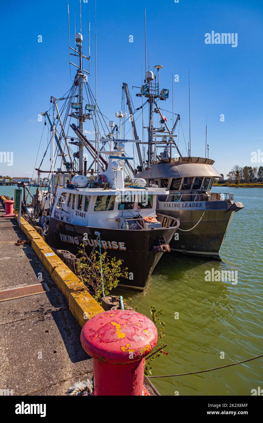 Commercial fishing vessels docked along the Steveston waterfront in British Columbia Canada Stock Photo