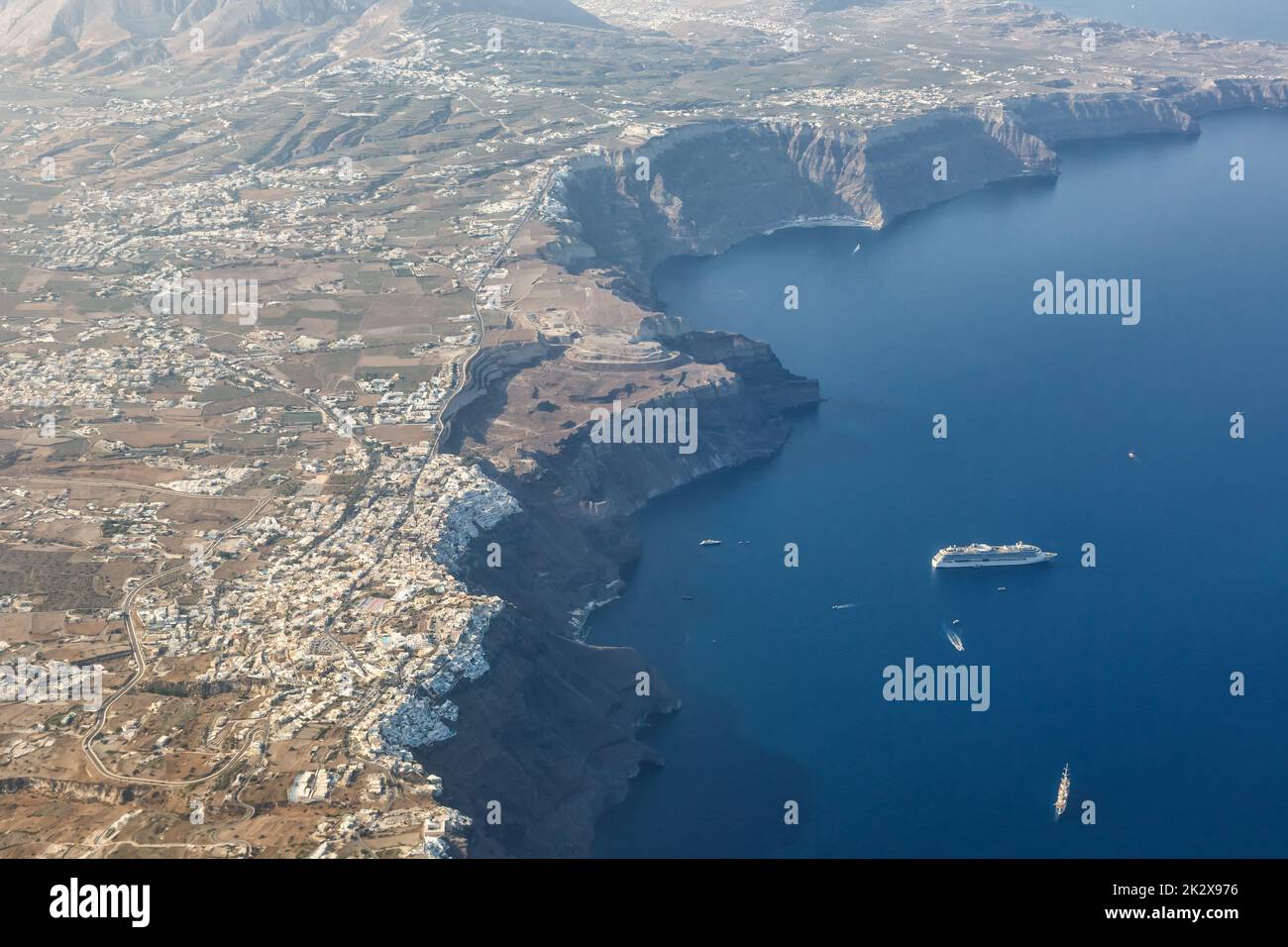 Santorini island holidays in Greece travel traveling Fira Thera town Mediterranean Sea aerial photo view Santorin ship Stock Photo