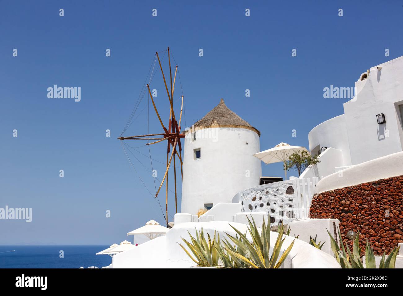 Windmill on Santorini island holidays in Greece travel traveling Oia town Mediterranean Sea Santorin mill Stock Photo