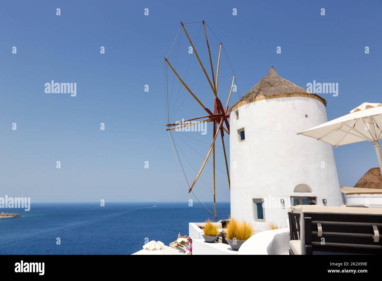 Windmill on Santorini island holidays in Greece travel traveling Oia town Mediterranean Sea Santorin mill Stock Photo