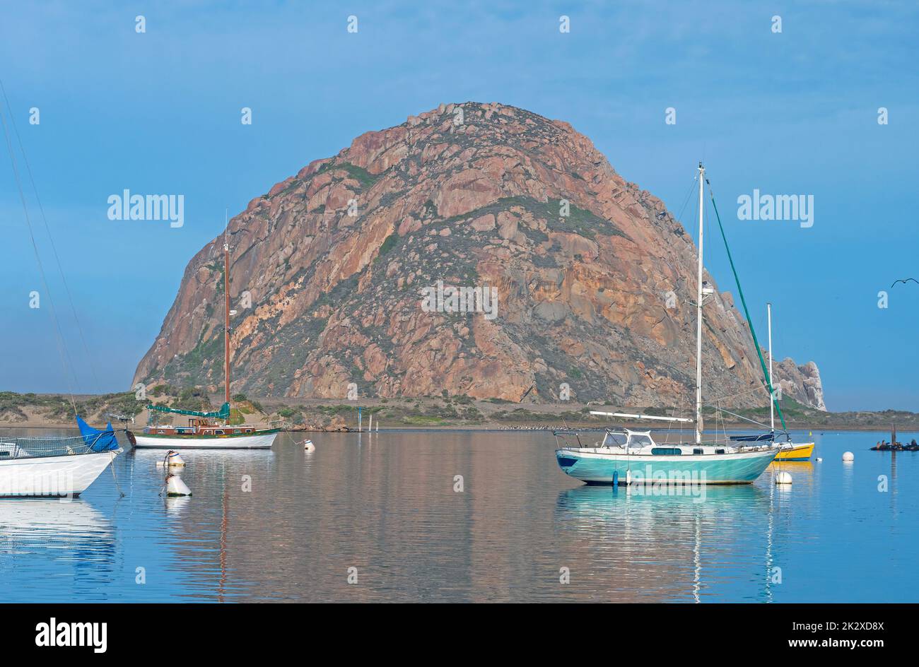 Distinctive Rock by a Idyllic Harbor Stock Photo