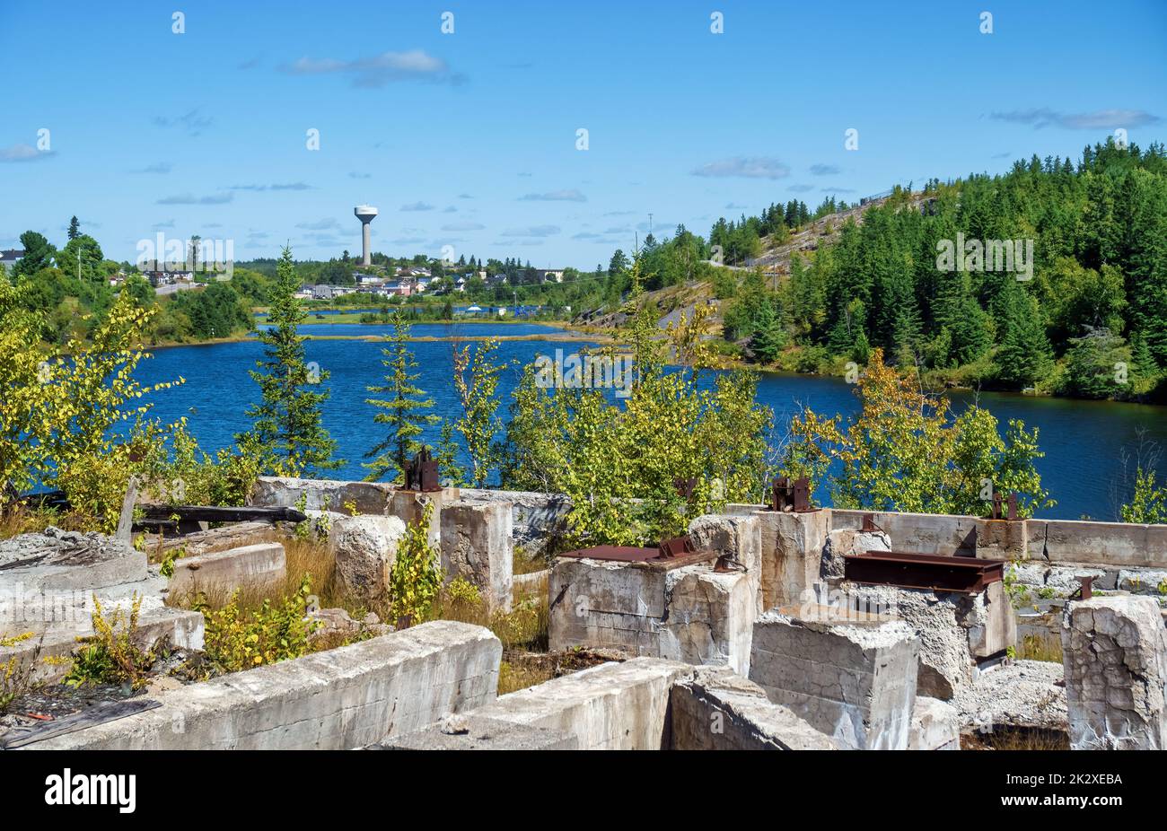 From the ruins of abandoned Hellens Mill along the Silver Heritage Trail, looking at the blue water of Cobalt Lake and skyline of the town. Stock Photo