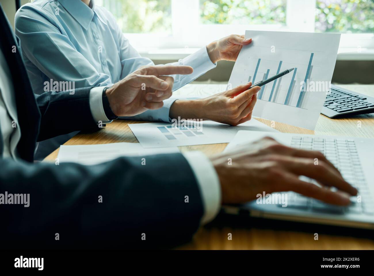 businessman teamwork and brainstorming. people analyzing and discussing business financial report in office Stock Photo