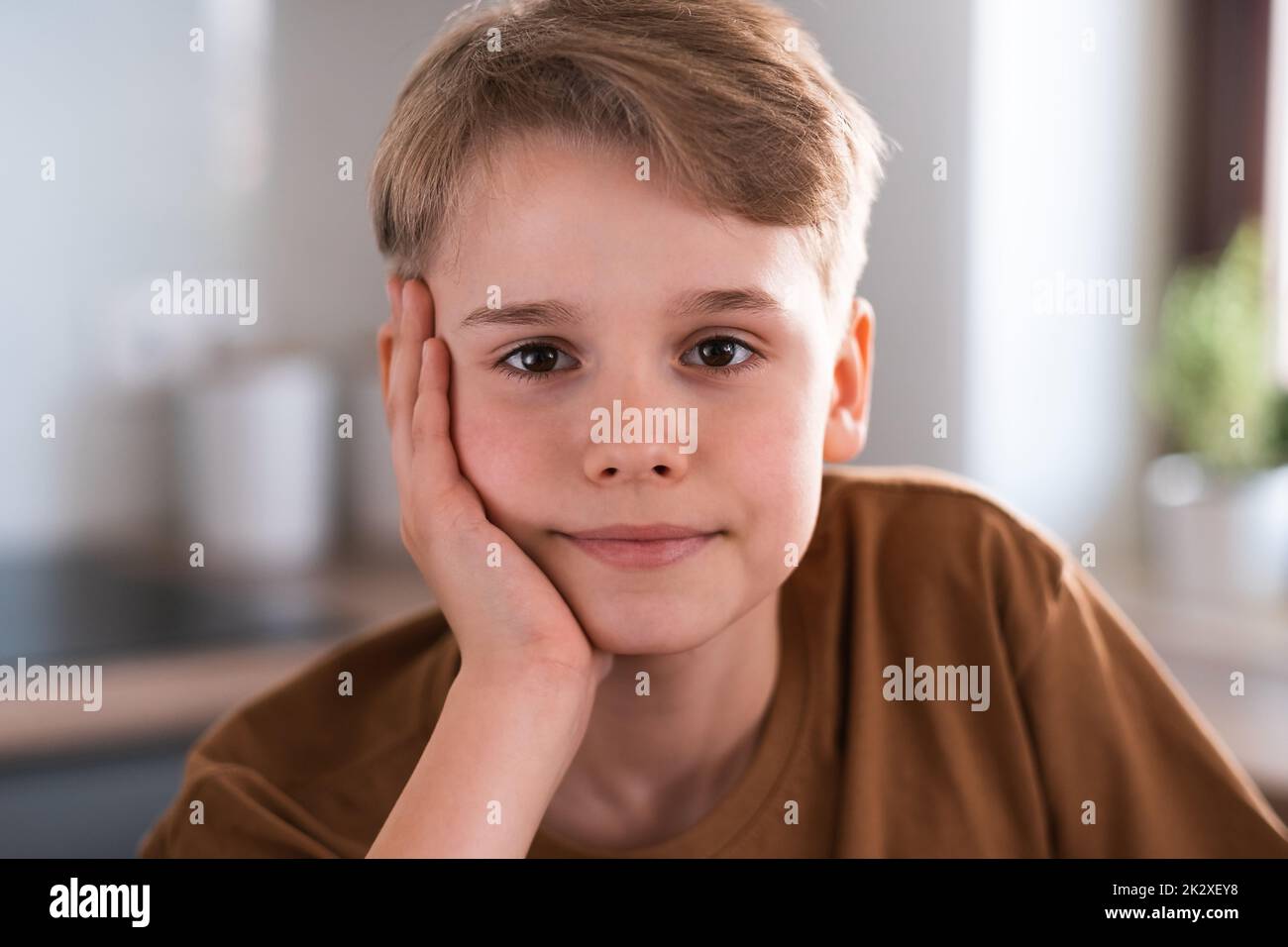 Close-up portrait teenager looking at the camera with a joyful smiling expression. Stock Photo