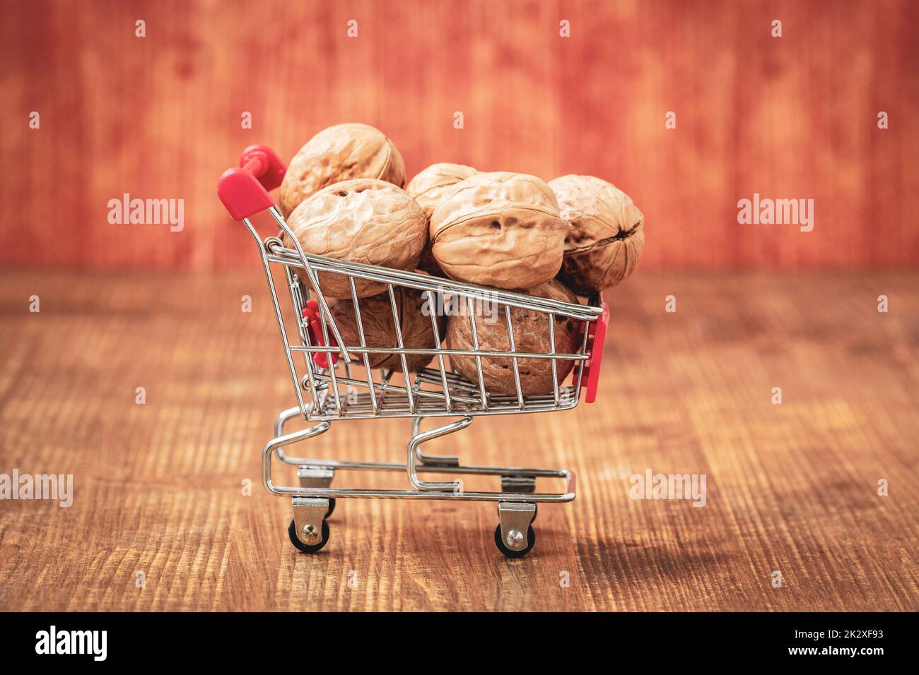 Shopping cart full of walnuts Stock Photo