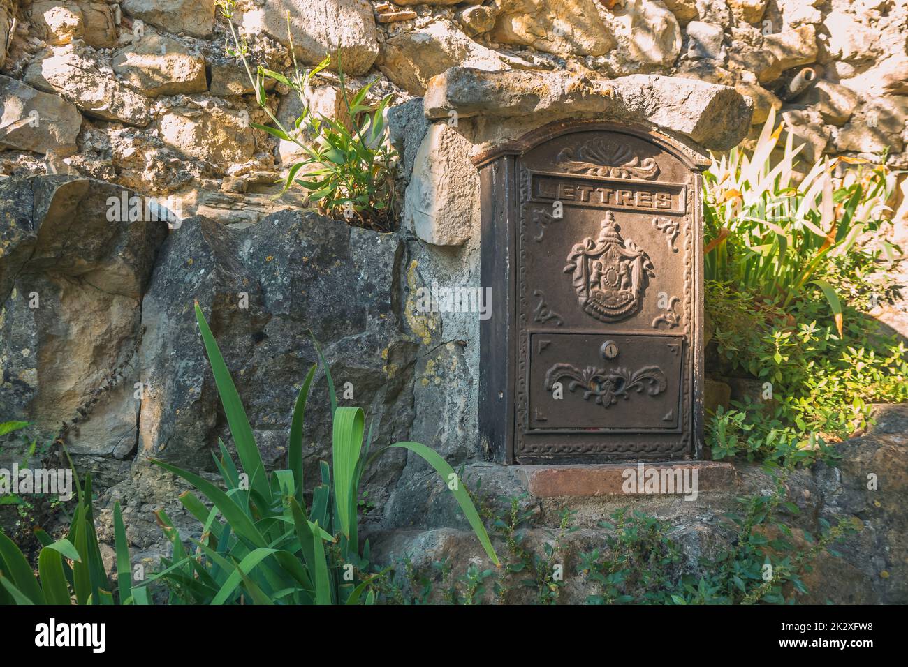 Old mailbox in an old french town. Vintage. Antic mailbox Stock Photo