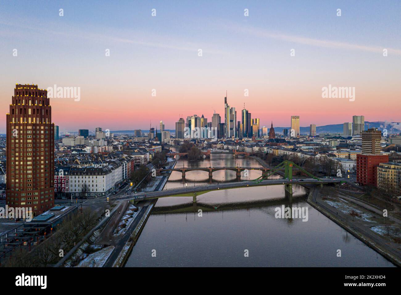 Aerial panoramic picture of Frankfurt skyline with river Main with colorful sky during sunrise Stock Photo