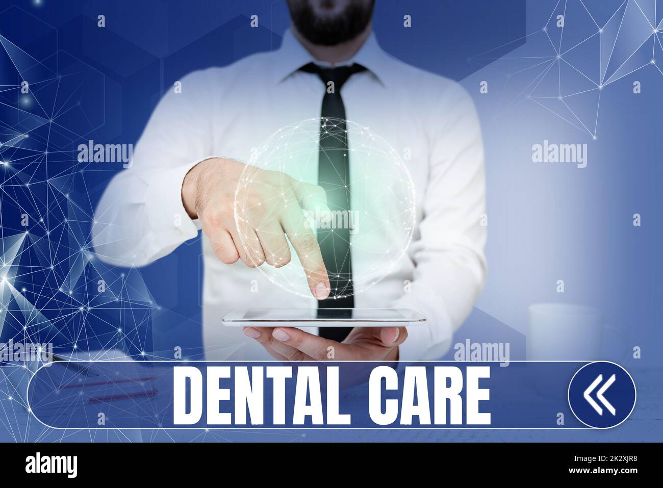 Conceptual display Dental Care. Business showcase maintenance of healthy teeth or to keep it clean for future Businessman pointing down tablet represents global innovative thinking. Stock Photo
