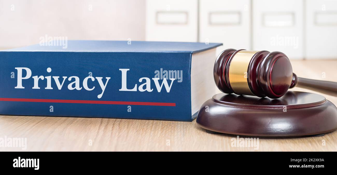 A law book with a gavel - Privacy law Stock Photo