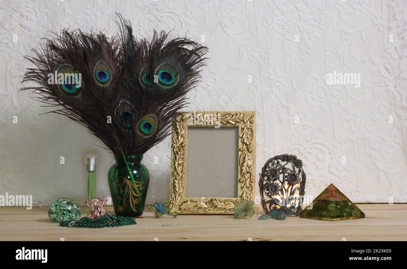 Vase of Peacock Feathers With Green Jewelry and Gold Photo Frame Stock Photo Alamy