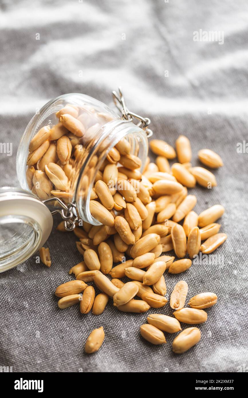 Roasted peeled peanuts in jar Stock Photo Alamy