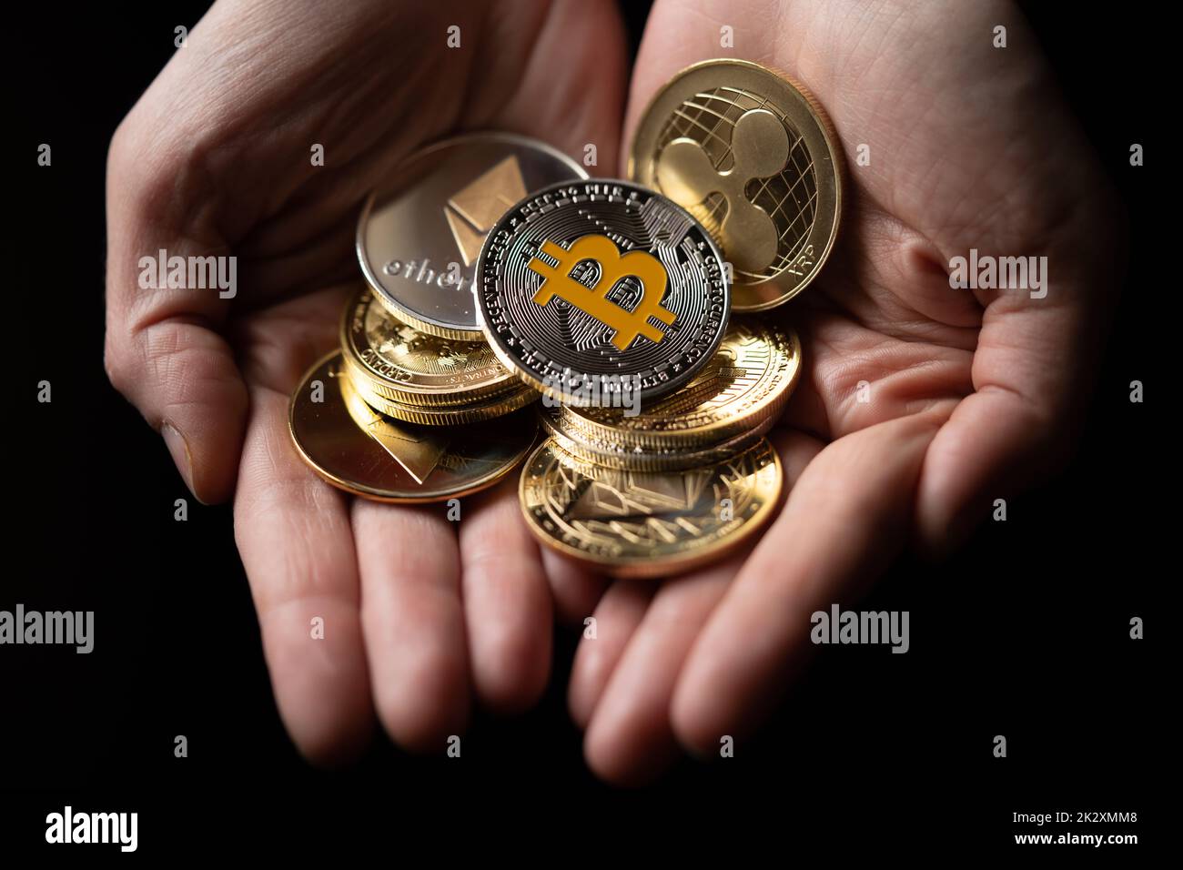 Silver and gold various digital cryptocurrencies, with Bitcoin on top Stock Photo