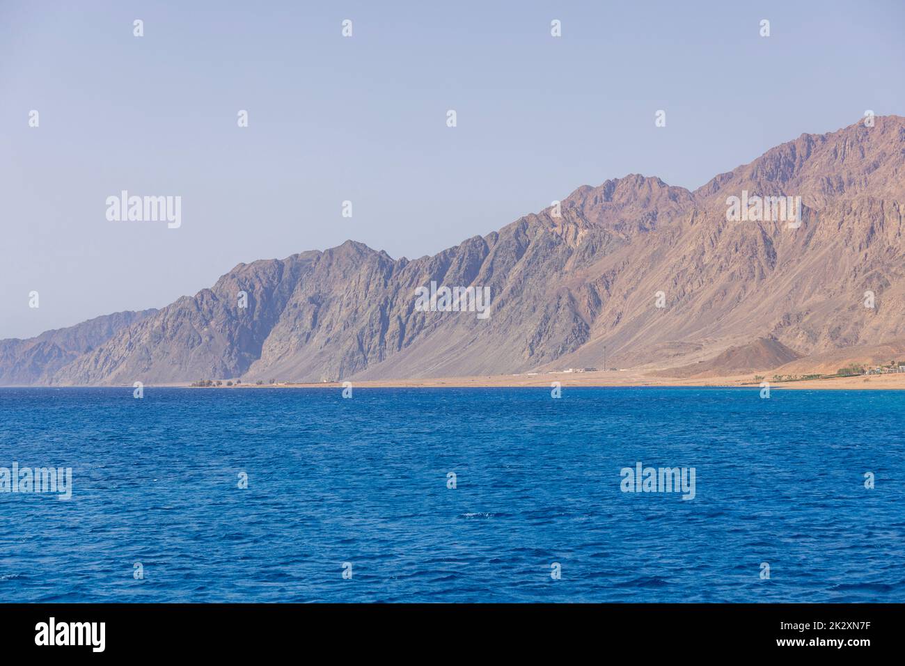 The Red Sea on the Gulf of Aqaba, surrounded by the mountains of the Sinai Peninsula, Dahab, Egypt Stock Photo