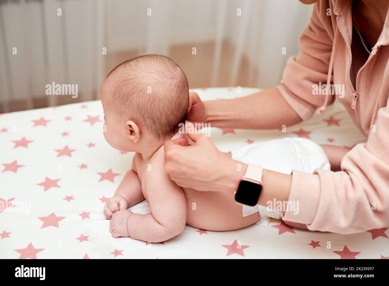 Baby massage. Mother massaging her newborn baby Stock Photo Alamy