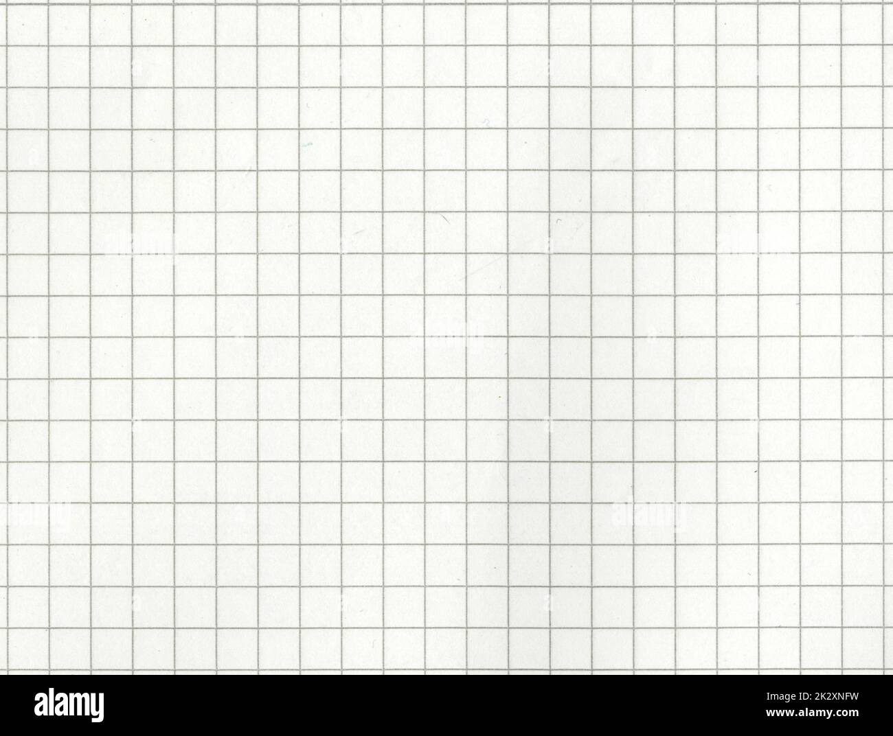 High resolution large image of a white uncoated checkered graph paper scan weathered beige tint thin textbook paper page with gray checkers copy space for text for presentation high quality wallpaper Stock Photo