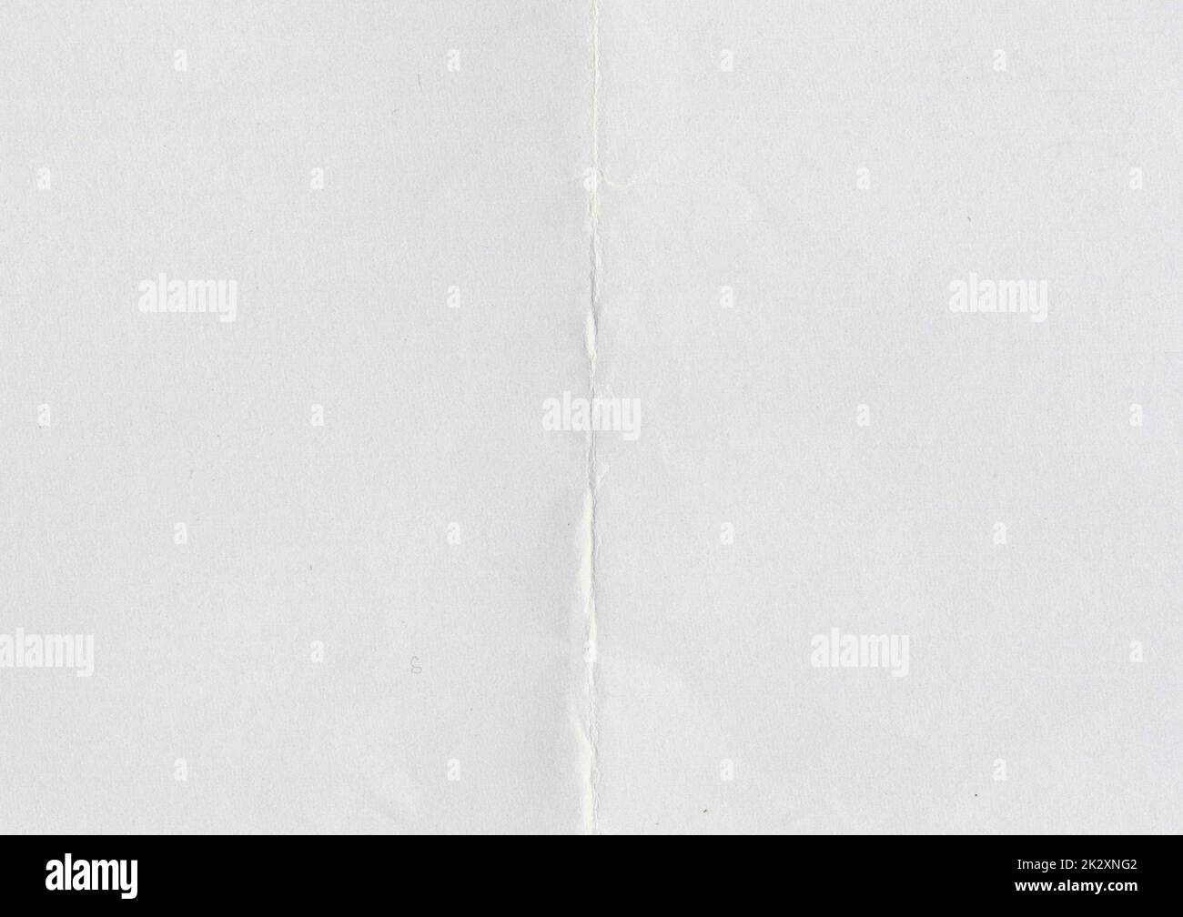 High resolution large image of white paper texture background scan folded in half, soft fine grain uncoated paper for water colors with copy space for text material mockup or presentation wallpaper Stock Photo