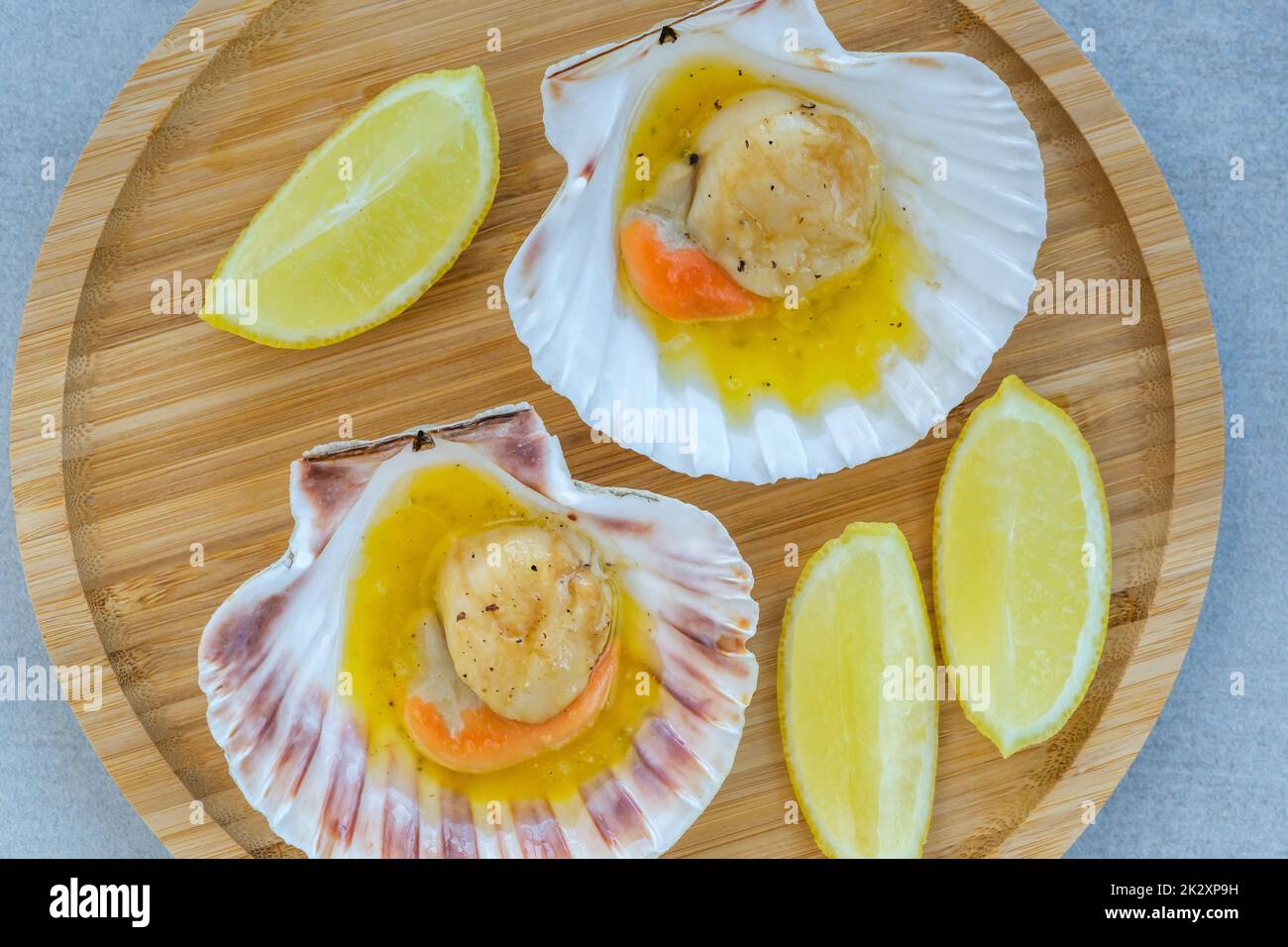 King scallop with roe and butter sauce in shell Stock Photo Alamy