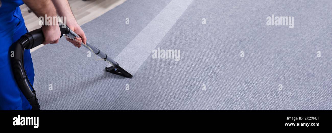 Janitor Cleaning Carpet Stock Photo