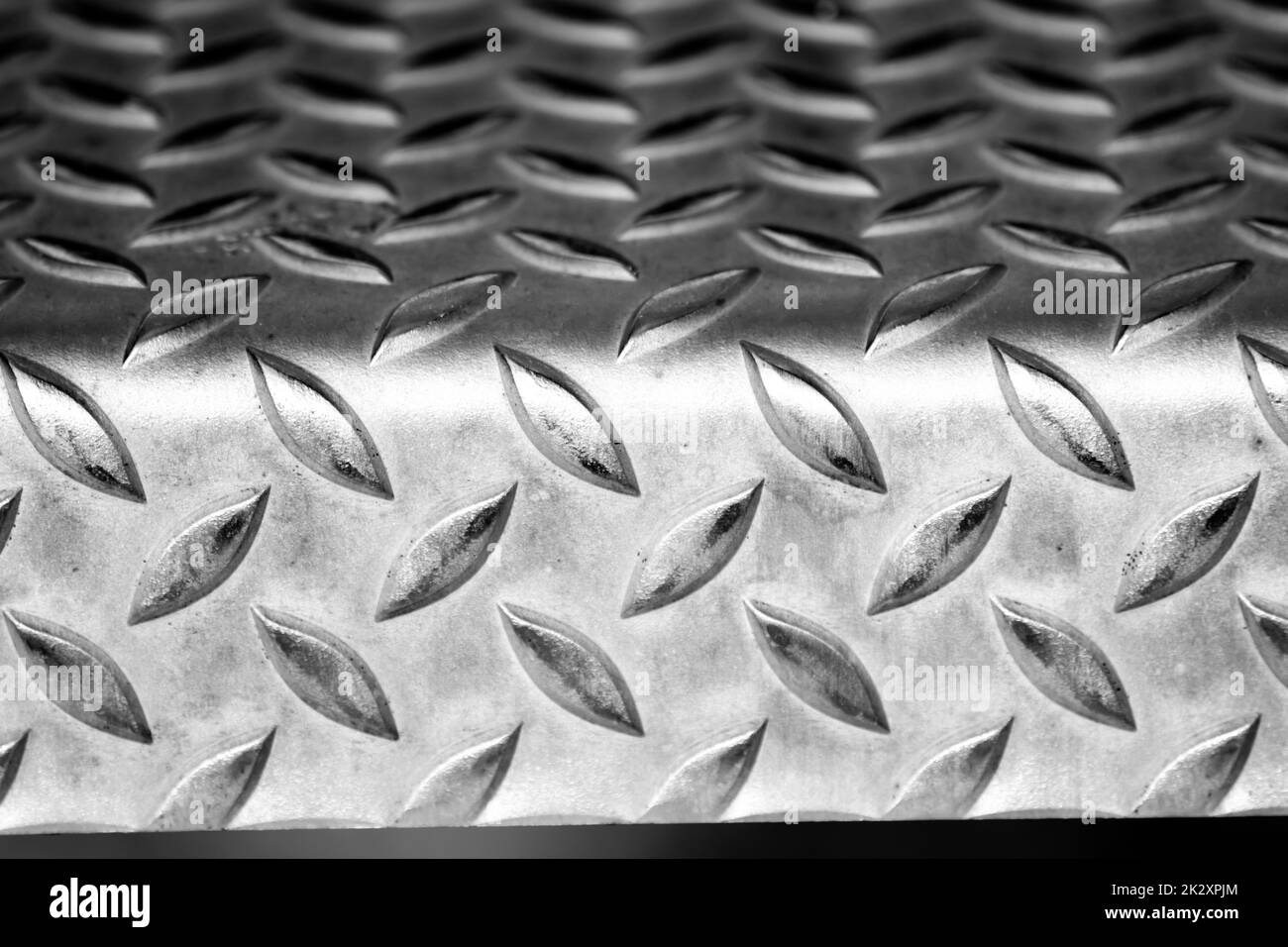 Solid diamond metal plate surface shows stainless steel flooring in